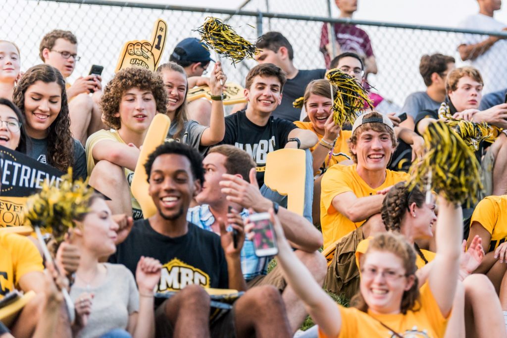 Students cheering on the UMBC Soccer Team